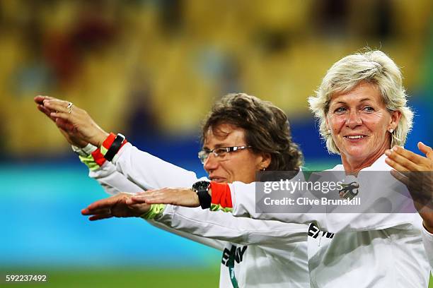 Head coach Silvia Neid of Germany celebrates following the Women's Olympic Gold Medal match between Sweden and Germany at Maracana Stadium on August...