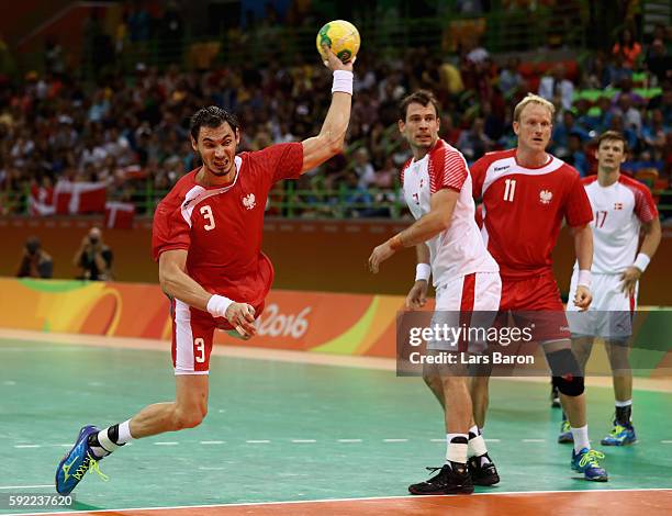 Krzysztof Lijewski of Poland takes a shot during the Men's Handball Semifinal match between Poland and Denmark on Day 14 of the Rio 2016 Olympic...