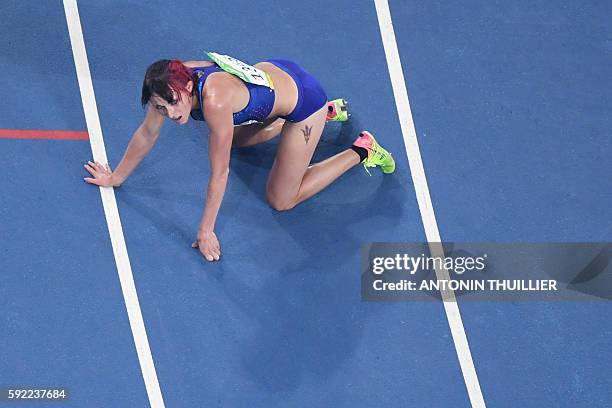 S Shelby Houlihan reacts after she competed in the Women's 5000m Final during the athletics event at the Rio 2016 Olympic Games at the Olympic...