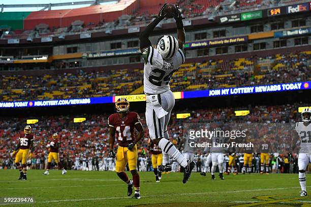 Cornerback Darrelle Revis of the New York Jets makes a first half interception against the Washington Redskinsat at FedExField on August 19, 2016 in...