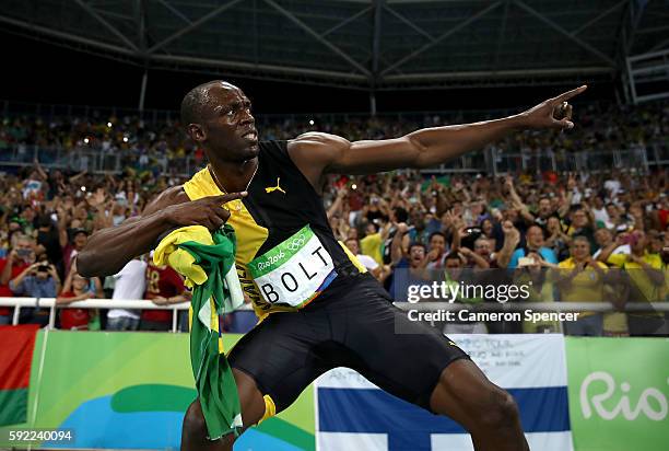 Usain Bolt of Jamaica celebrates after winning the Men's 4 x 100m Relay Final on Day 14 of the Rio 2016 Olympic Games at the Olympic Stadium on...