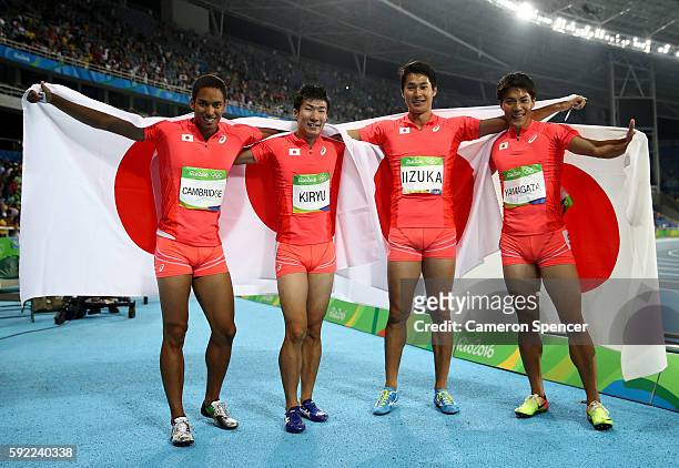 Ryota Yamagata, Shota Iizuka, Yoshihide Kiryu and Aska Cambridge of Japan celebrates after winning silver in the Men's 4 x 100m Relay Final on Day 14...