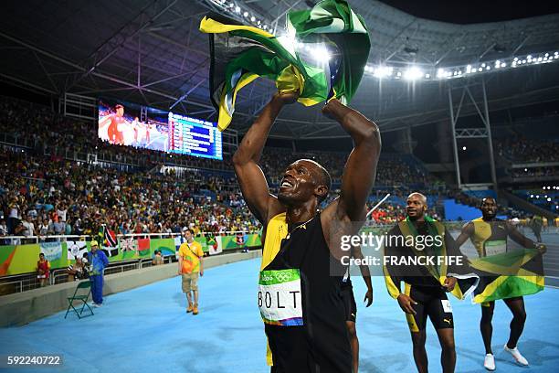 Jamaica's Usain Bolt , Jamaica's Asafa Powell and Jamaica's Nickel Ashmeade celebrate after Team Jamaica won the Men's 4x100m Relay Final during the...