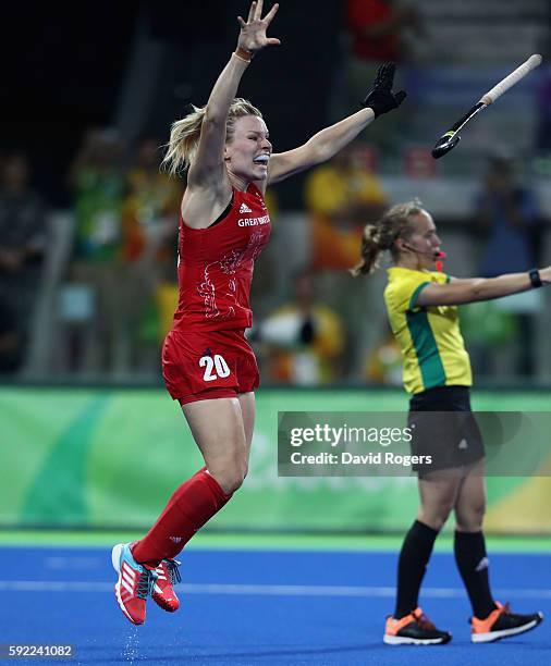 Hollie Webb of Great Britain celebrates after scoring the winning penalty against the Netherlands during the Women's hockey Gold medal match between...