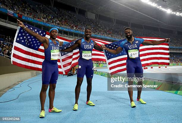 Mike Rodgers, Justin Gatlin and Tyson Gay of the United States celebrate prior to being disqualified after the Men's 4 x 100m Relay Final on Day 14...