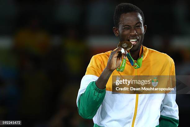 Gold medalist Cheick Sallah Cisse of Cote d'Ivoire poses on the podium during the medal ceremony for the Men's Taekwondo -80kg Contest on Day 14 of...