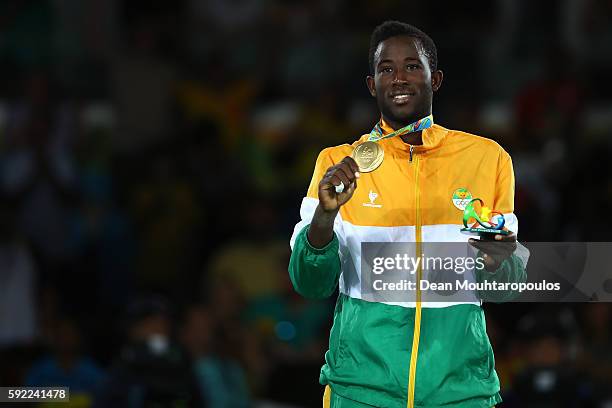 Gold medalist Cheick Sallah Cisse of Cote d'Ivoire poses on the podium during the medal ceremony for the Men's Taekwondo -80kg Contest on Day 14 of...