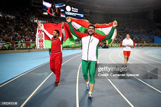 Dilshod Nazarov of Tajikistan, gold, Ivan Tsikhan of Belarus, silver, and Wojciech Nowicki of Poland bronze celebrate after the Men's Hammer Throw...