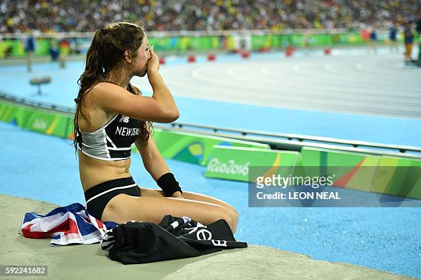 New Zealand's Eliza McCartney reacts after she won the bronze medal in the Women's Pole Vault Final during the athletics event at the Rio 2016...