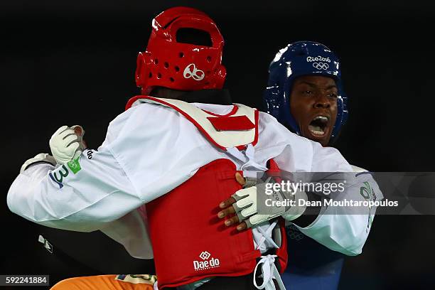 Lutalo Muhammad of Great Britain competes against Cheick Sallah Cisse of Cote d'Ivoire in the Men's Taekwondo -80kg Gold Medal Contest on Day 14 of...