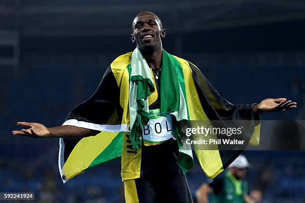 Usain Bolt of Jamaica celebrates winning the Men's 4 x 100m Relay Final on Day 14 of the Rio 2016 Olympic Games at the Olympic Stadium on August 19,...