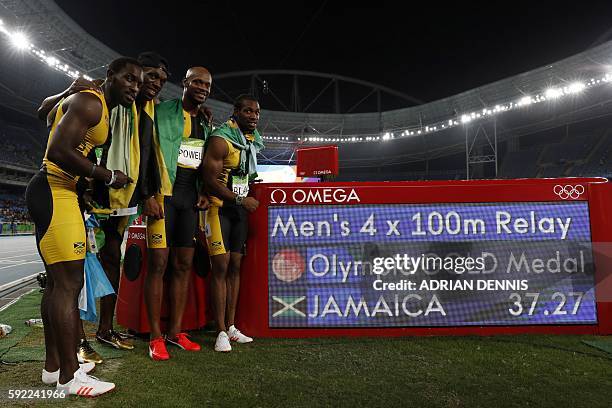 Team Jamaica Jamaica's Nickel Ashmeade, Jamaica's Usain Bolt, Jamaica's Asafa Powell and Jamaica's Yohan Blake celebrate after winning the Men's...