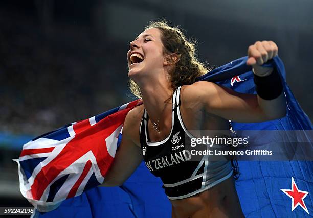 Eliza Mccartney of New Zealand celebrates winning bronze in the Women's Pole Vault Final on Day 14 of the Rio 2016 Olympic Games at the Olympic...