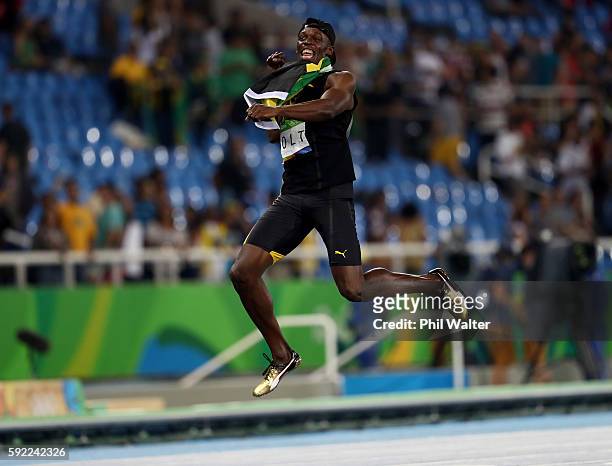 Usain Bolt of Jamaica celebrates winning the Men's 4 x 100m Relay Final on Day 14 of the Rio 2016 Olympic Games at the Olympic Stadium on August 19,...