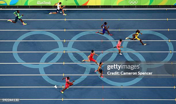 Usain Bolt of Jamaica runs ahead of of Aska Cambridge of Japan, Trayvon Bromell of the United States and Andre De Grasse of Canada in the Men's 4 x...