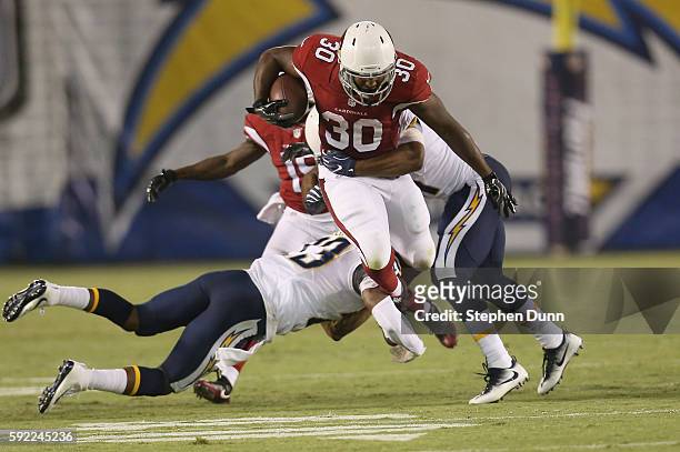Running back Stepfan Taylor of the Arizona Cardinals leaps as he carries the ball against the San Diego Chargers during preseason at Qualcomm Stadium...