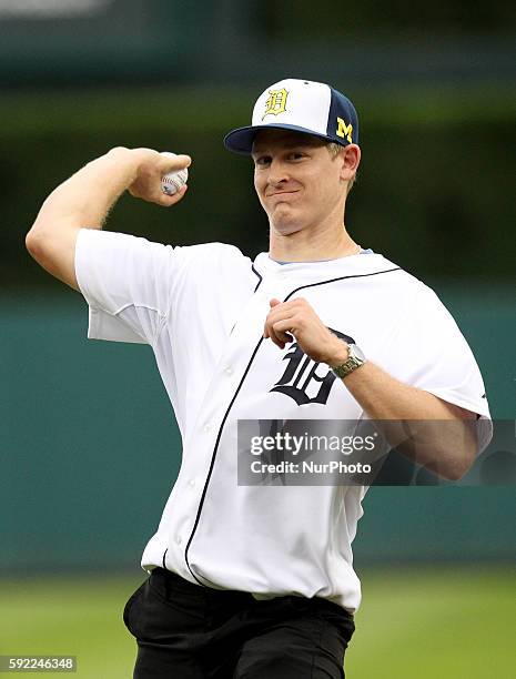 Detroit Lions quarterback Jake Rudock, throws out a ceremonial first pitch during University of Michigan night in a baseball game between the Detroit...