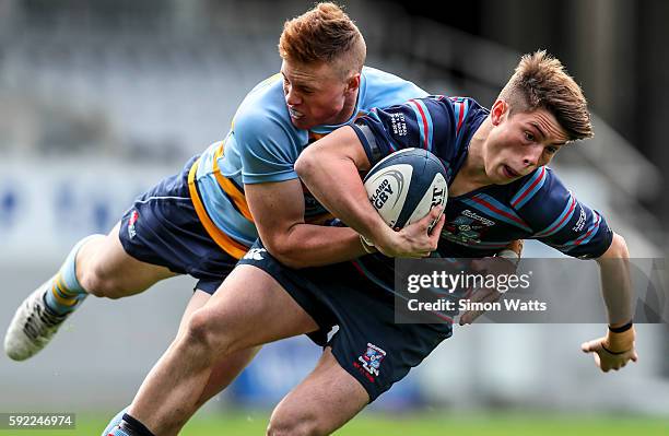 George Witana of Sacred Heart is tackled by Harley Maynard of Mount Albert Grammar during the Auckland Secondary Schools Final match between Mount...