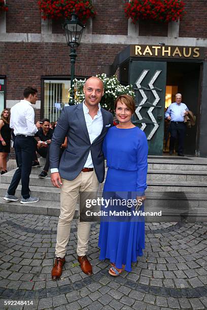 Christian Tewes and Jenny Juergens attend the Herzwerk Vernissage 'auf den 2ten Blick' at City Hall on August 19, 2016 in Duesseldorf, Germany.