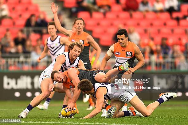 Steve Johnson of the Giants is tackled Hayden Crozier of the Dockers during the roUnd 22 AFL match between the Greater Western Sydney Giants and the...