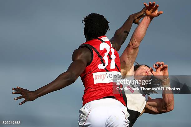 Gach Nyuon of Essendon and Matthew Eagles of North Ballarat compete for the ball during the round 20 VFL match between North Ballarat and Essendon at...