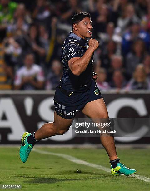 Jason Taumalolo of the Cowboys celebrates after scoring a try during the round 24 NRL match between the North Queensland Cowboys and the New Zealand...