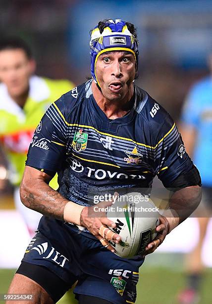 Johnathan Thurston of the Cowboys runs the ball during the round 24 NRL match between the North Queensland Cowboys and the New Zealand Warriors at...