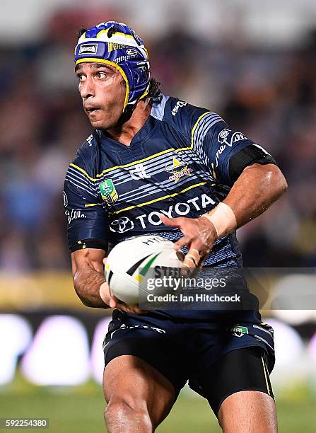 Johnathan Thurston of the Cowboys passes the ball during the round 24 NRL match between the North Queensland Cowboys and the New Zealand Warriors at...