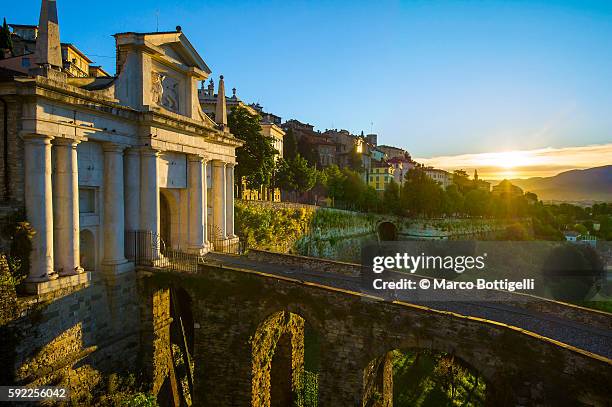 bergamo, lombardy, italy. sunrise on the city walls and st james door. - bergamo stock pictures, royalty-free photos & images