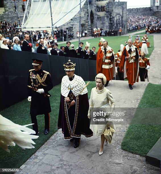 Investiture Ceremony of the Prince of Wales at Caernarfon Castle. Her Majesty Queen Elizabeth II and her son Prince Charles walk towards Queen...