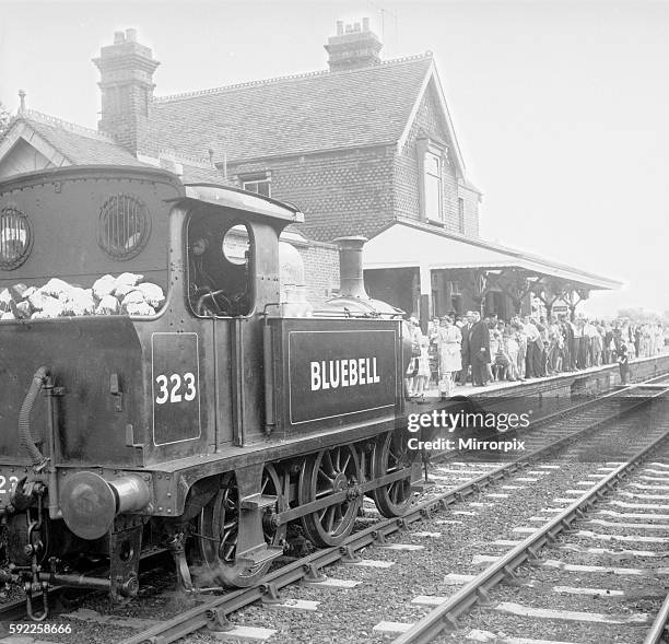 Crowds on the platform at Horsted Keynes station await the arrival of South East & Chatham Railway locomotive 323, named 'Bluebell' from Sheffield...