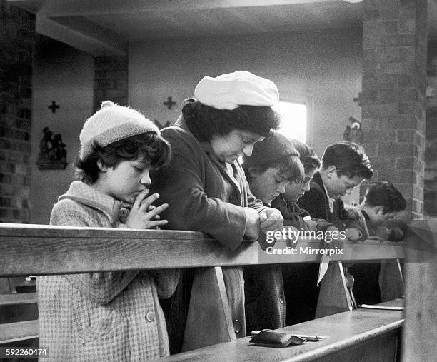 Shiela Kilbride, mother of John Kilbride, with family, prays for her son, who she hasn't seen for 18 months today, 15th May 1965, which is his...