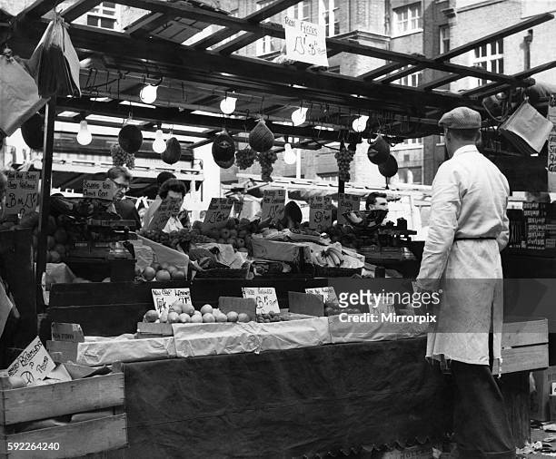 Greengrocers stall in East Street Market, London. Circa 1965