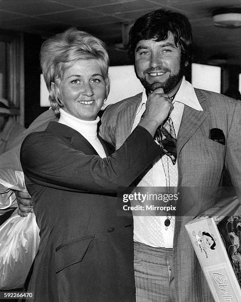 Comedian Jimmy Tarbuck flew into London airport today sporting a beard. With his wife, Pauline. October 1969 P006224