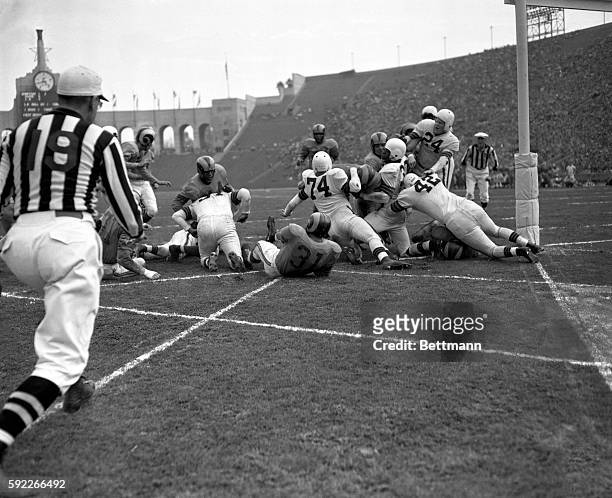 Hoerner , of the Los Angeles Rams, plunges three yards for a Rams touchdown during the second quarter of their game against the Cleveland Browns for...