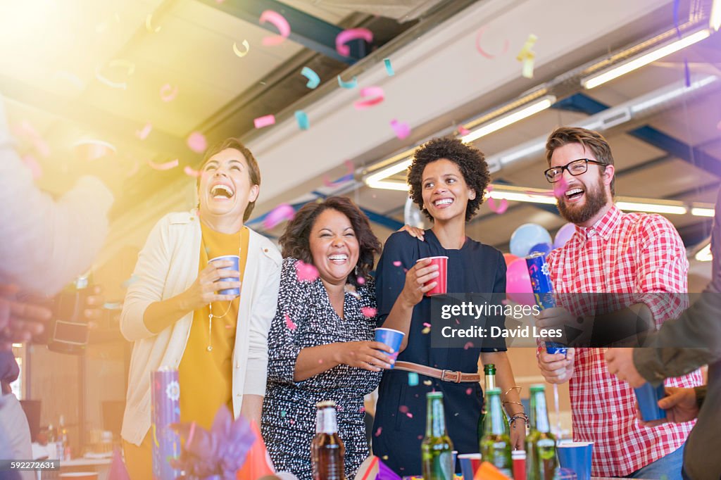 Smiling business people at office party