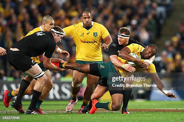 Tevita Kuridrani of the Wallabies is tackled by the All Blacks defence during the Bledisloe Cup Rugby Championship match between the Australian...