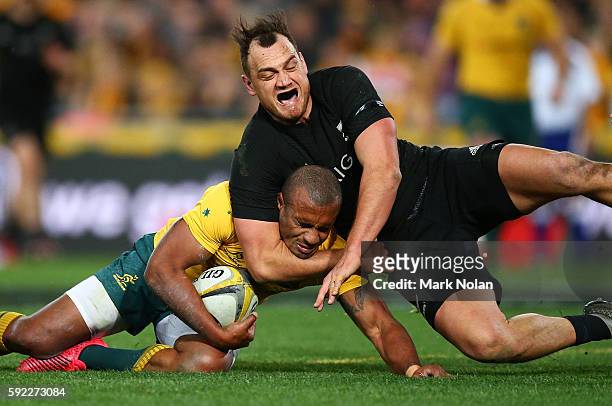 Israel Dagg of the All Blacks tackles Will Genia of the Wallabies during the Bledisloe Cup Rugby Championship match between the Australian Wallabies...