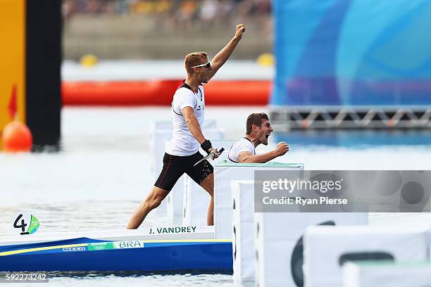 Sebastian Brendel of Germany and Jan Vandrey of Germany celebrate winning the Men's Canoe Double 1000m on Day 15 of the Rio 2016 Olympic Games at the...