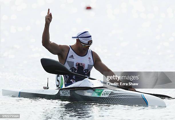 Liam Heath of Great Britain celebrates winning the gold medal in the Men's Kayak Single 200m Finals on Day 15 of the Rio 2016 Olympic Games at the...