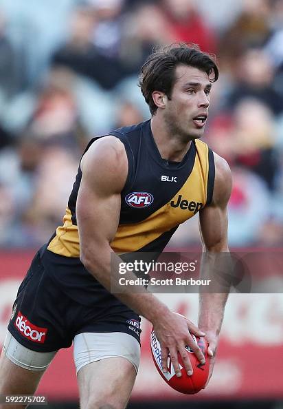 Alex Rance of the Tigers runs with the ball during the round 22 AFL ...
