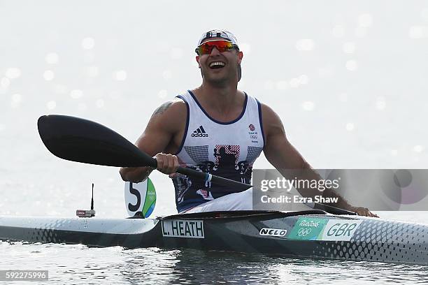 Liam Heath of Great Britain celebrates winning the gold medal in the Men's Kayak Single 200m Finals on Day 15 of the Rio 2016 Olympic Games at the...