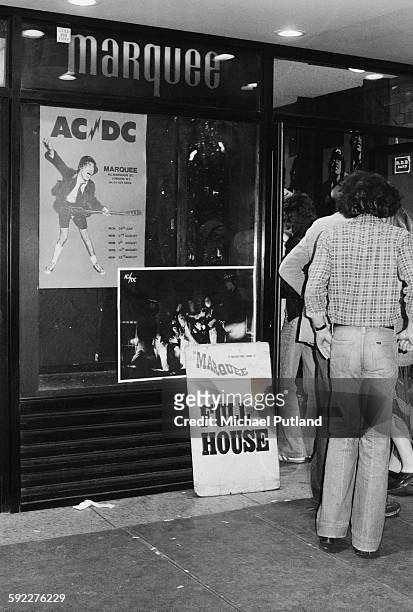 Fans entering the Marquee Club on Wardour Street, London, before a concert by hard rock group AC/DC, 11th August 1976.