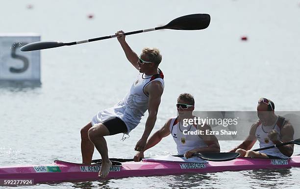 Max Rendschmidt of Germany jumps into the water after winning the gold medal in the Men's Kayak Four 1000m Finals on Day 15 of the Rio 2016 Olympic...