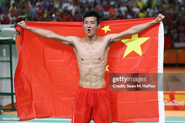 Long Chen of China celebrates victory over Chong Wei Lee of Malaysia during the Men's Singles Badminton Gold Medal match on Day 15 of the Rio 2016...