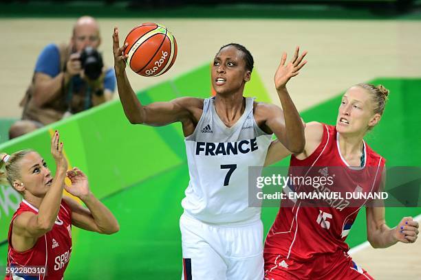 Serbia's point guard Milica Dabovic, France's centre Sandrine Gruda and Serbia's power forward Danielle Page go for a rebound during a Women's Bronze...