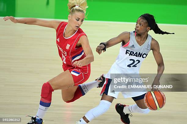 France's point guard Olivia Epoupa works around Serbia's point guard Milica Dabovic during a Women's Bronze medal basketball match between France and...