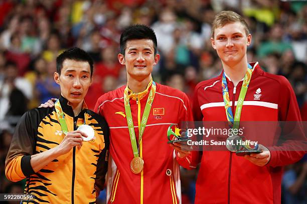 Silver medalist Chong Wei Lee of Malaysia, gold medalist Long Chen of China and bronze medalist Viktor Axelson of Denmark pose on the podium during...