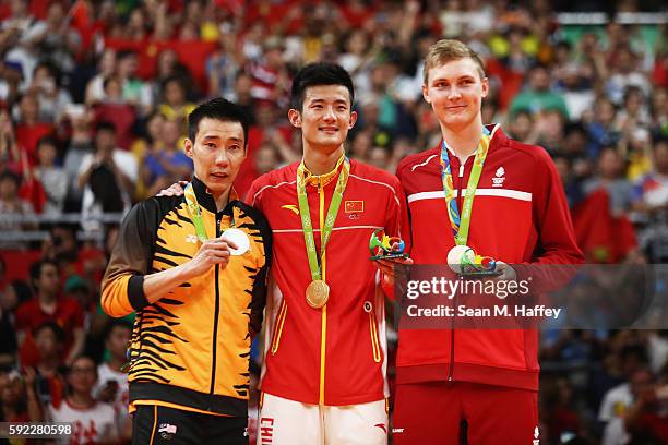 Silver medalist Chong Wei Lee of Malaysia, gold medalist Long Chen of China and bronze medalist Viktor Axelson of Denmark pose on the podium during...