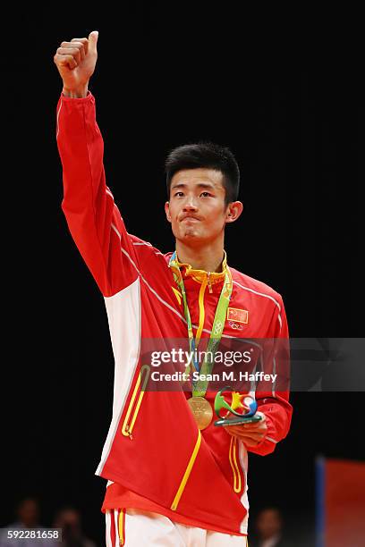 Gold medalist Long Chen of China poses on the podium during the medal ceremony for the Men's Singles Badminton on Day 15 of the Rio 2016 Olympic...